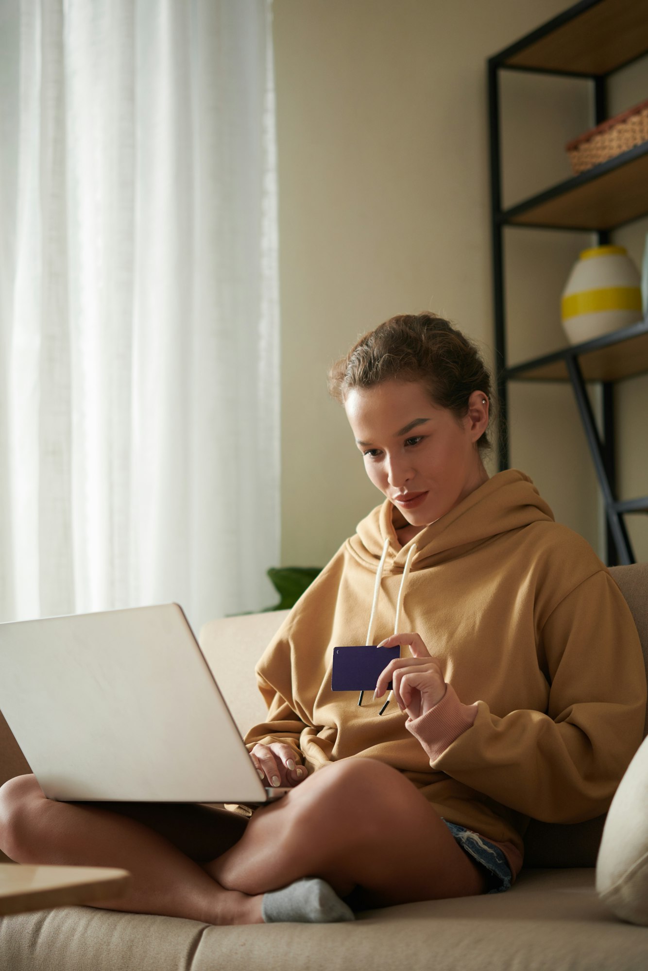 Woman paying online on the laptop