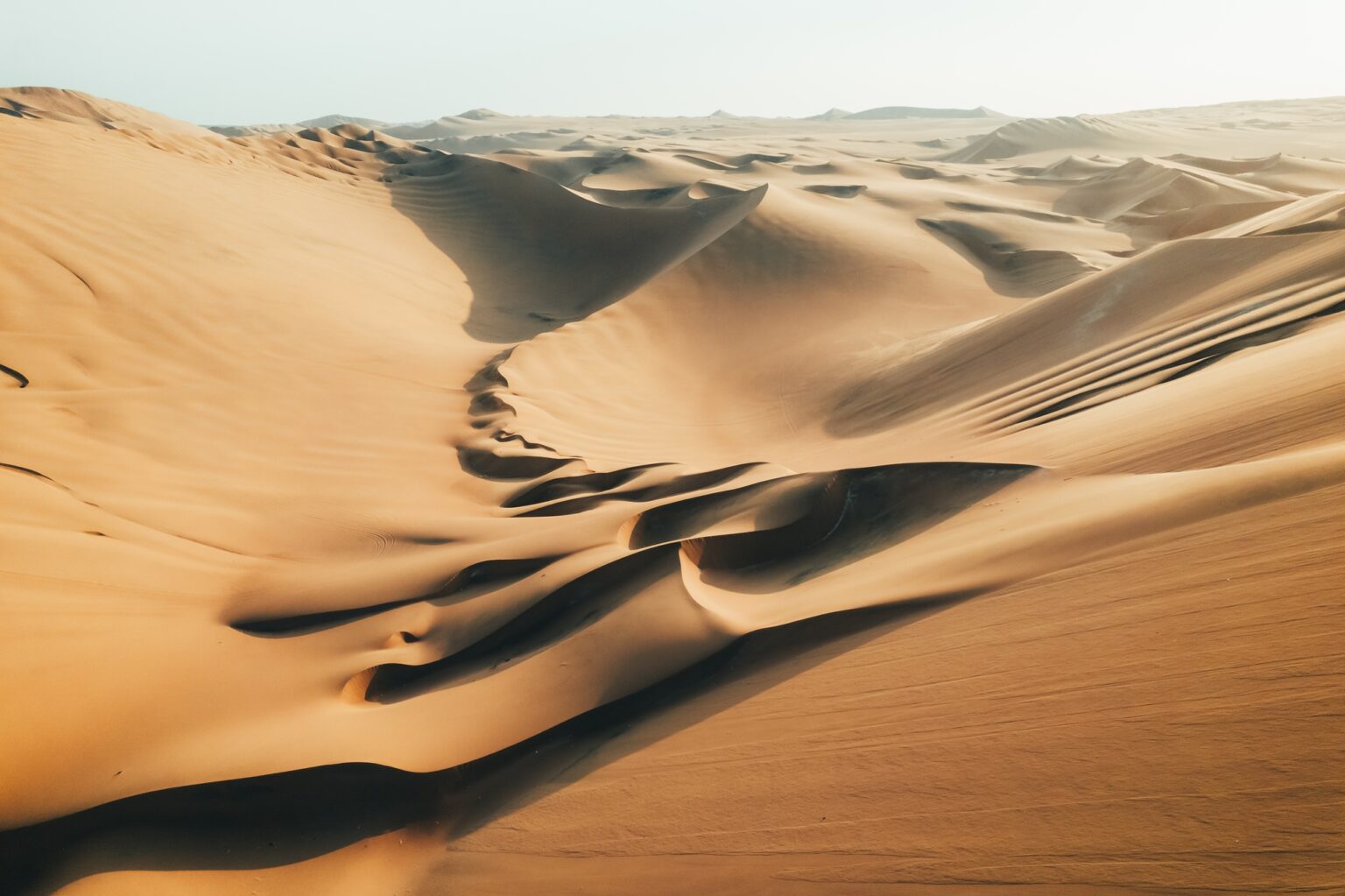 Aerial sunset photo of desert textures in Huacachina, Ica, Peru, South America