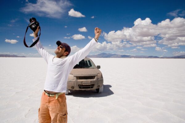 Photographer celebrates in a salt field, Salinas Grandes, Cordoba Province, Argentina