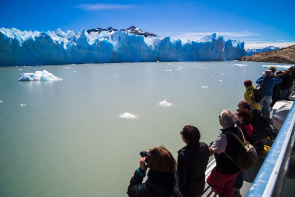 Tourist boat trip, with people on vacation in Argentina, visiting Perito Moreno Glacier, Los Glaciar